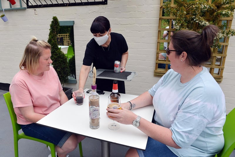 THe warm weather was the perfect excuse to enjoy some refreshments at Cakefield Cakes Tea Room in Pleasley. Here Stacey Wilkinson and Lucy Smith are being served by Wendy.