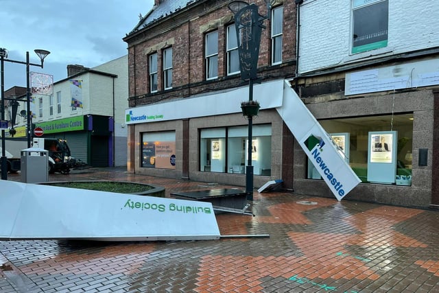Shop signage damaged by the wind in Sunderland city centre.