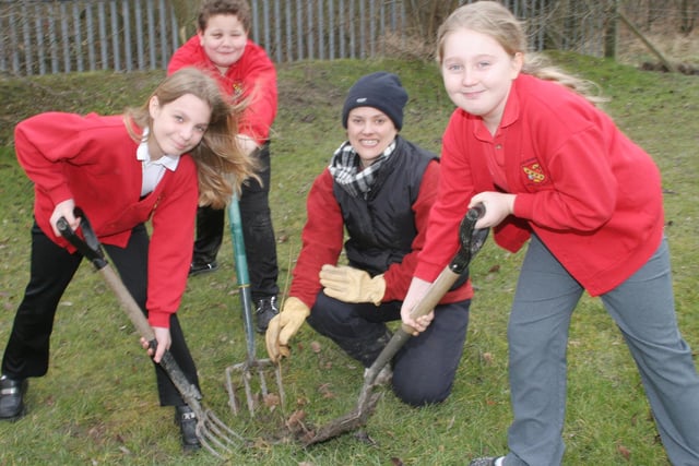 Elie Walker, Eldon Poole, Theresa Raybould and Megan Saunt prepare the ground ready for planting at Poolsbrook School in 2006.