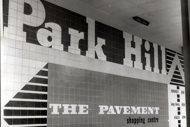 Sheffield's Park Hill flats had 31 shops when they were opened in 1961. This picture, taken in 1964, shows a sign directing people to The Pavement shopping centre