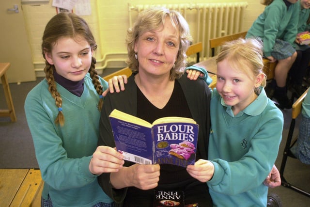 Sheffield High School pupils being talked to by author Anne Fine as part of World Book Day. Anne, centre with one of her books the Flour Babies, and Celia Lacey, left and Melissa Gibbons in 2001.