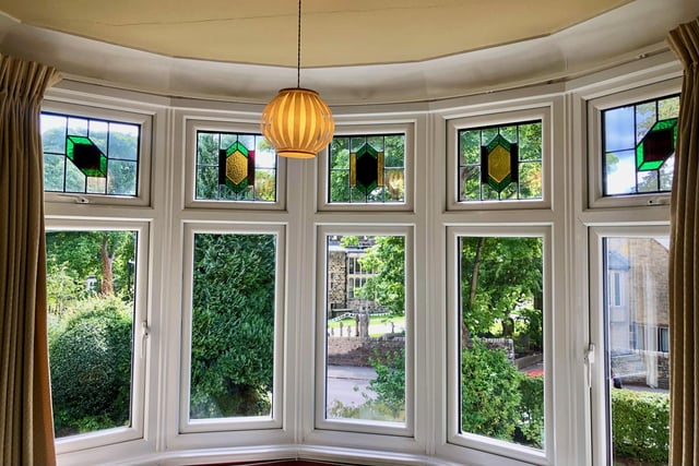 Original features such as upstairs and downstairs stained glass bay windows have been retained