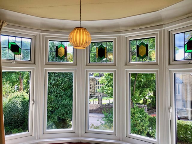 Original features such as upstairs and downstairs stained glass bay windows have been retained