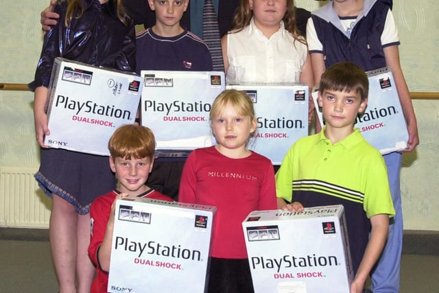 PlayStation winners, back row, from left, Kirsty Gardner, aged 12, Kris Kennedy, aged 12,  Louise Tipper, aged ten, and Nicola McBurnie, aged 15; front, Christopher Turner, aged eight, Rebecca Barnett, aged seven, and Thomas Widdowson, aged nine.  The presentation took place October 2000
