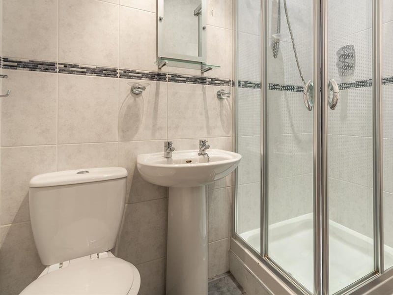 Complete with enclosed shower, low-flush WC and wash hand basin.