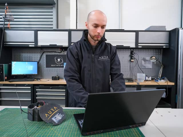 Aura Flights, which is based in Sheffield, has sent hundreds of people's ashes into space. Pictured is Matthew, programming one of the control modules for the flights.