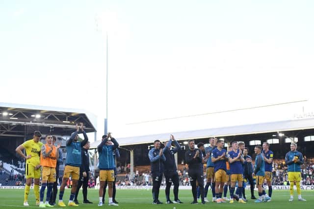 Players and staff of Newcastle United applaud fans after the Premier League match between Fulham FC and Newcastle United at Craven Cottage on October 01, 2022 in London, England. (Photo by Tom Dulat/Getty Images)