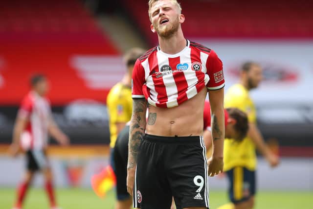 A dejected Oli McBurnie shows his depair following Sheffield United's defeat by Arsenal: Simon Bellis/Sportimage