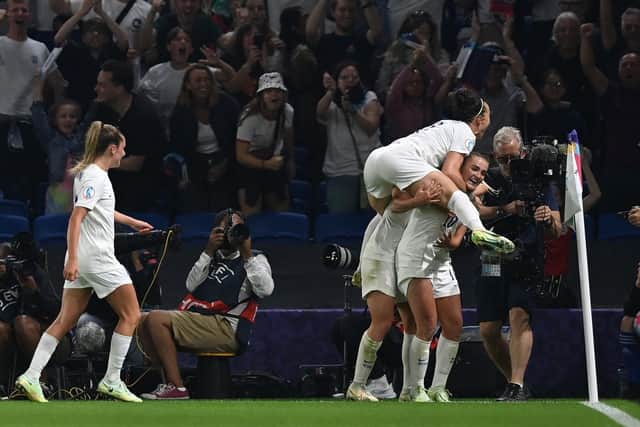 England's players celebrate their second goal scored by midfielder Georgia Stanway during the UEFA Women's Euro 2022 quarter final football match between England and Spain at the Brighton & Hove Community Stadium, in Brighton, southern England on July 20, 2022. (Photo by Glyn KIRK / AFP).