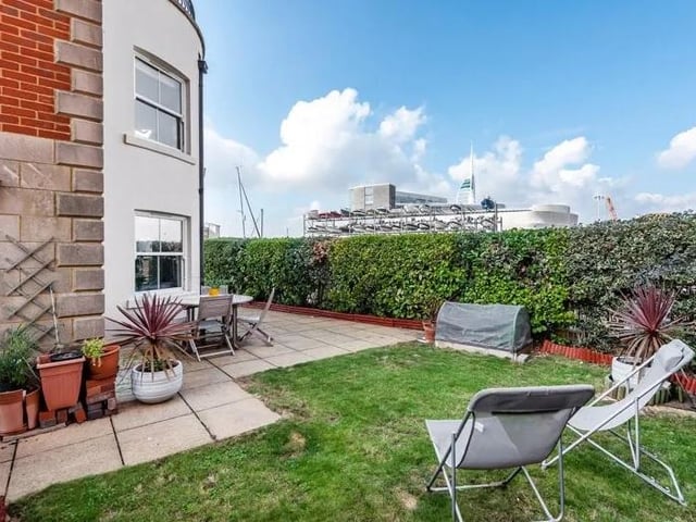 This four bedroom terraced home with views over Camber Dock, Old Portsmouth is on sale for £950,000. Here is the garden and patio area.