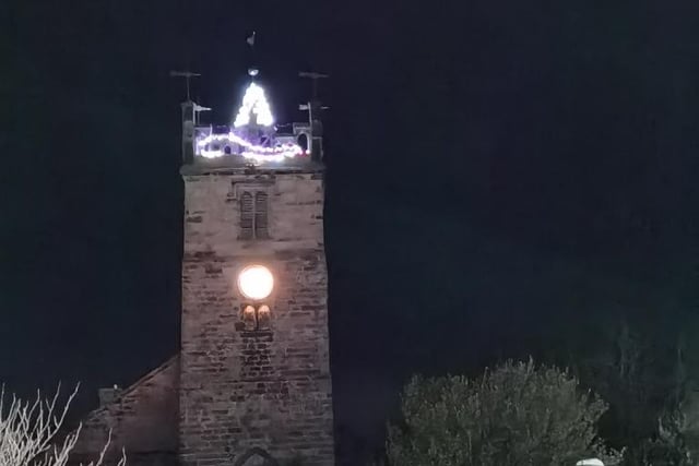 The top of St Mary's Church has been illuminated.