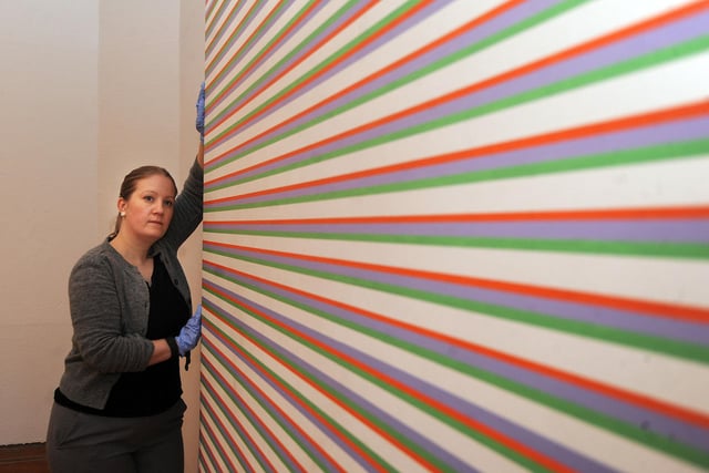 Bridget Riley: Venice and Beyond, Paintings 1967-1972 showcased the op-art pioneer's craft in 2016. Curator Louisa Briggs is pictured installing Late Morning (1967).
