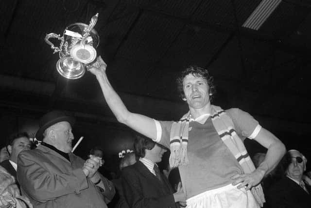 Manchester City captain Mike Doyle with the League Cup after beating Newcastle United 2-1:  PA/PA Wire