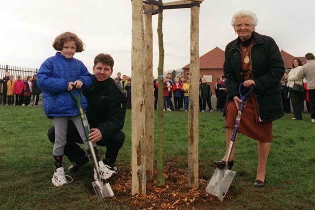 Stainforth School pupil Carrie Errington, Fire fighter Matthew Briggs and the Mayor of Doncaster Margaret Robinson plant one of the new trees at Stainfroth Primary School as part of a combined promotion of the Millenium tree Project.