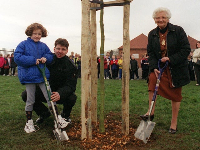 Stainforth School pupil Carrie Errington, Fire fighter Matthew Briggs and the Mayor of Doncaster Margaret Robinson plant one of the new trees at Stainfroth Primary School as part of a combined promotion of the Millenium tree Project.