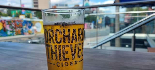 A refreshing pint of Orchard Thieves cider enjoyed on the Showroom Bar Café terrace.