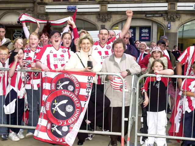Fans line the route to the Town Hall to meet the players.