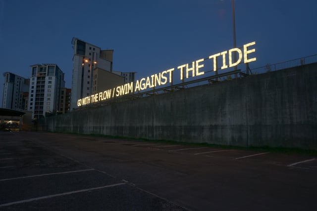 Occupying a prominent position in Seaham Marina is GO WITH THE FLOW / SWIM AGAINST THE TIDE, a large-scale LED text sculpture by Tim Etchells (UK), pairing two well-known phrases, which seem to contradict each other, hinting at the social struggles of compliance and resistance.