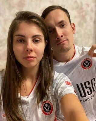 Vitaly Iskakov and his wife, who is now also a Sheffield United fan, at their home in St Petersburg