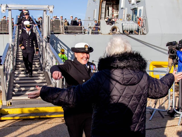 Crew members embrace family as they step off HMS Diamond. Picture: Habibur Rahman