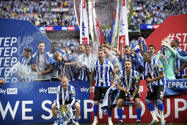 Owls lift the Play Off Final trophy Pic Steve Ellis