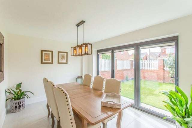 Dining Room - With bifolding doors giving access to the patio with garden beyond. The dining room is open plan to the kitchen which makes this an ideal space for entertaining. Tiled flooring flows from the dining room to the superb living dining kitchen.