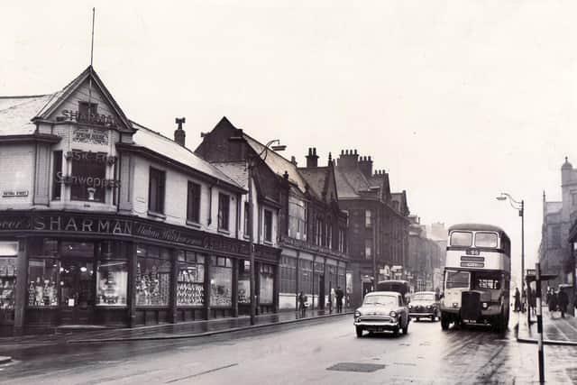 West Street, Sheffield in January 1961. Caption reads "The junction of West Street with Fitzwilliam Street - an illustration of a self-contained shopping centre, away from mid-city bustle, yet with stores to meet virtually every demand of the housewife and her family"