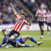Cardiff City's Jack Simpson (left) and Sheffield United's James McAtee battle for the ball during the Sky Bet Championship match at Bramall Lane: Richard Sellers/PA Wire.