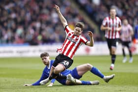 Cardiff City's Jack Simpson (left) and Sheffield United's James McAtee battle for the ball during the Sky Bet Championship match at Bramall Lane: Richard Sellers/PA Wire.