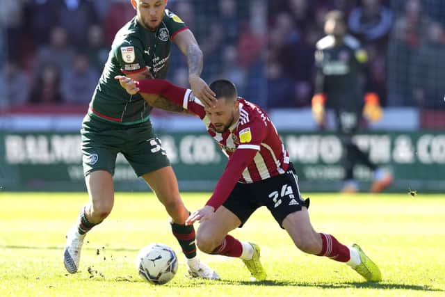 Sheffield United's players, including former Barnsley midfielder Conor Hourihane, negotiated their way through some tough periods at Bramall Lane: Andrew Yates / Sportimage
