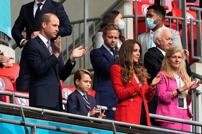 Onlookers Prince William, Duke of Cambridge (L), and Catherine, Duchess of Cambridge, clap next to their son George, at Wembley (Pool/AFP/Getty Images)