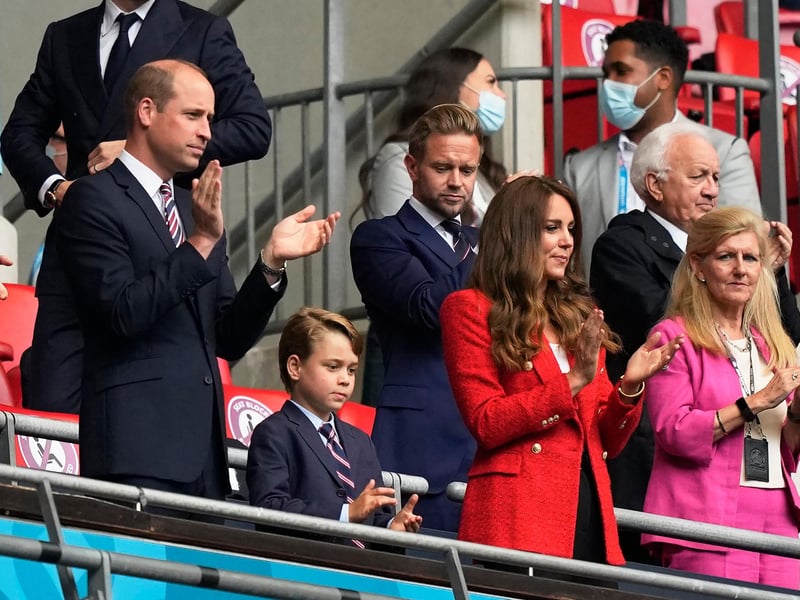 Onlookers Prince William, Duke of Cambridge (L), and Catherine, Duchess of Cambridge, clap next to their son George, at Wembley (Pool/AFP/Getty Images)