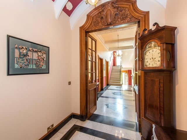 More marble flooring in this long and grand hallway