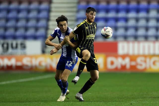 Jack Baldwin of Bristol Rovers battles for possession with Kyle Joseph of Wigan Athletic during the Sky Bet League One match between Wigan Athletic and Bristol Rovers at DW Stadium: Lewis Storey/Getty Images