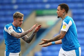 Peterborough United's Jonson Clarke-Harris (right) celebrates scoring their side's fifth goal of the game, completing a hat-trick, against Accrington Stanley: Nigel French/PA Wire.