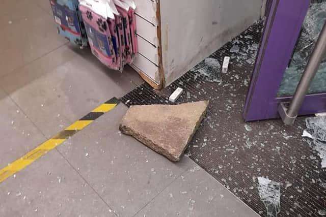 A paving slab that was used to break the glass door. Picture by Stephanie Godfrey