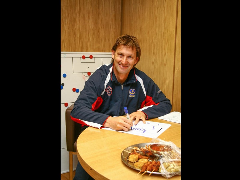 Tony Adams writes out the team sheet. Picture: Habibur Rahman