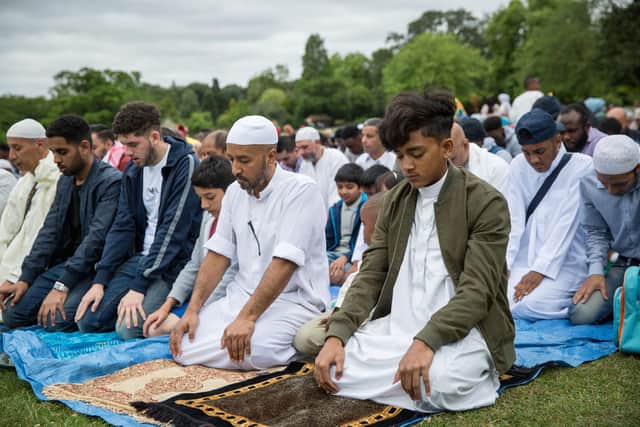 Members of Muslim community pray during Eid celebrations (Photo by Rob Stothard/Getty Images)
