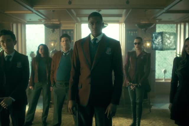 The Umbrella Academy with Justin H. Min as Ben Hargreeves, Cazzie David as Jayme, Jake Epstein as Alphonso, Justin Cornwell as Marcus, Britne Oldford as Fei, Genesis Rodriguez as Sloan.