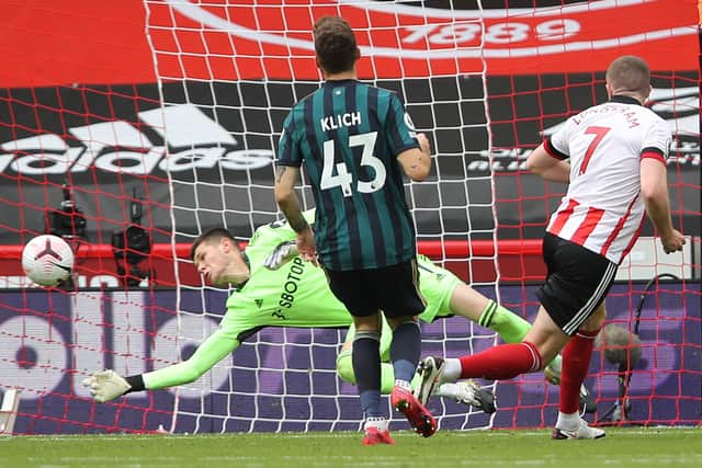 Leeds United goalkeeper Illan Meslier produces a fine save to deny John Lundstram's during his side's 1-0 win over Sheffield United at Bramall Lane yesterday. (Photo by MOLLY DARLINGTON/POOL/AFP via Getty Images)