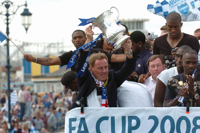 Harry holds the FA Cup trophy up high for the fans to see. Picture: Malcolm Wells 082235-244