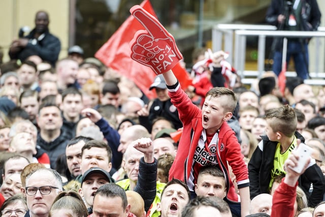 Sheffield United fans celebrate their promotion to the Premier League at Sheffield Town Hall, May 7, 2019