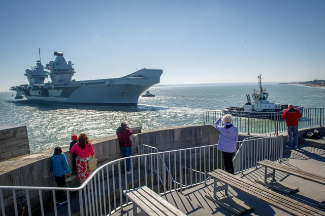Handful of people watch HMS Prince of Wales returning home from the Round Tower
