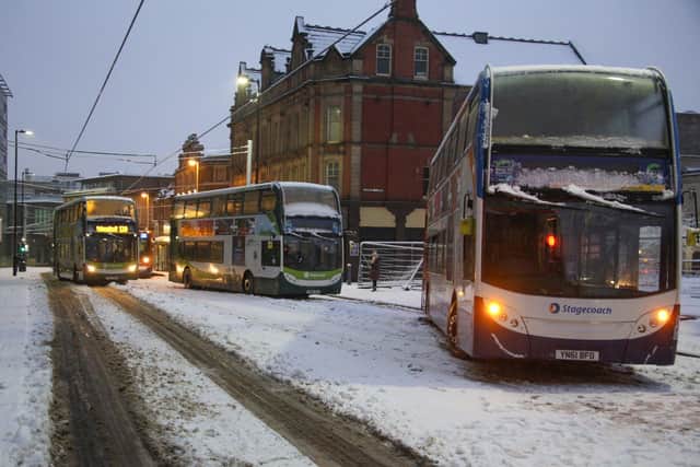 Buses stuck on West Street after heavy snow in Sheffield. Picture by Richard Argent.