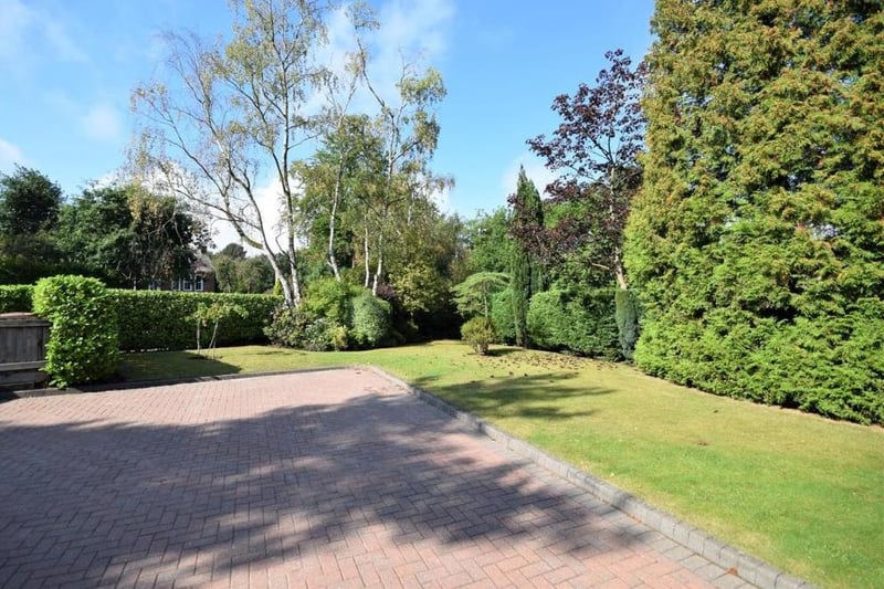 Back outside now, and a look at the attractive, large front garden at the Sheepwalk Lane property. It is lawned and westerly facing to appreciate the evening sun, and also bordered with mature shrubs and trees.