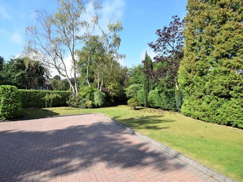 Back outside now, and a look at the attractive, large front garden at the Sheepwalk Lane property. It is lawned and westerly facing to appreciate the evening sun, and also bordered with mature shrubs and trees.