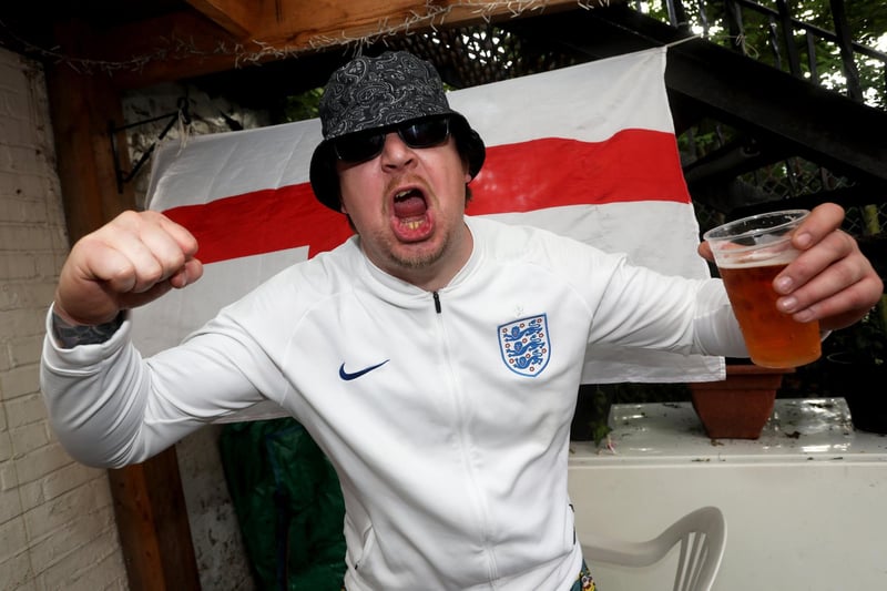 England fans pictured at the Milton Arms in Portsmouth, UK, about to watch England play on TV in the Semi-finals at Wembley. Pictured is Mark O'Neill enjoying the night. Picture: Sam Stephenson