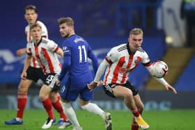 Oli McBurnie beats Timo Werner during Sheffield United's defeat at Chelsea: David Klein/Sportimage
