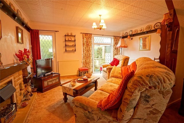 This lounge is situated to the rear of the property, with a double glazed rear door providing access to the garden.