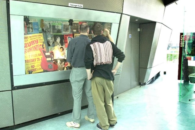 Visitors look at exhibits on the last day of opening in 2000.